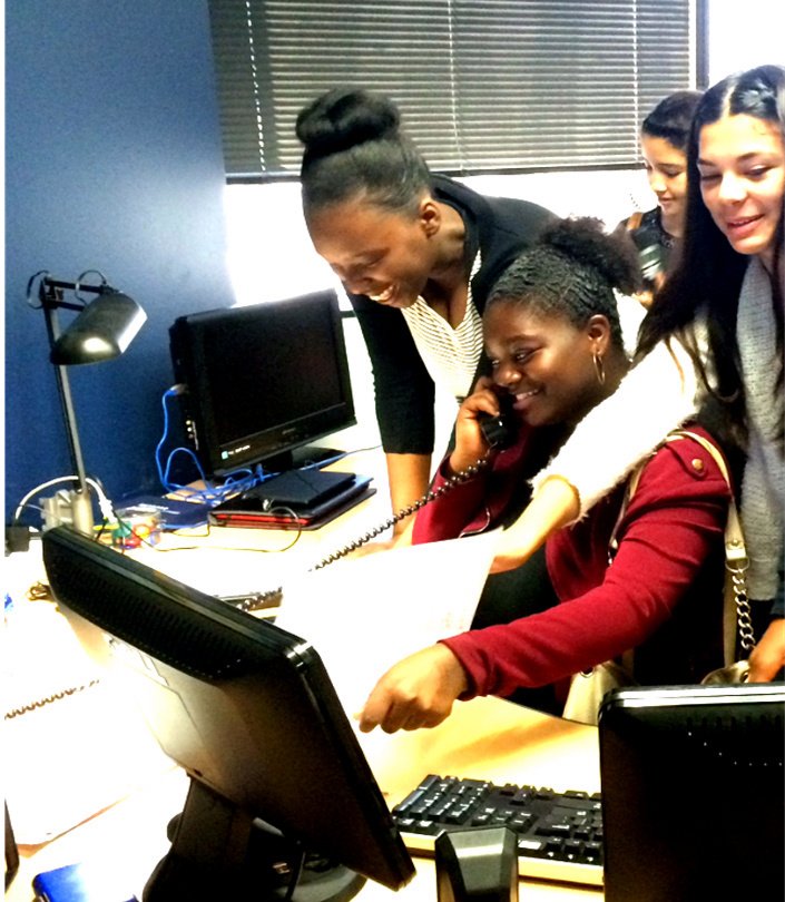 Students and a teacher work at a computer at Jessie Nelson Middle School as part of the Education Equals Opportunity, Too, Foundation program at Long Beach schools. (Courtesy photo)