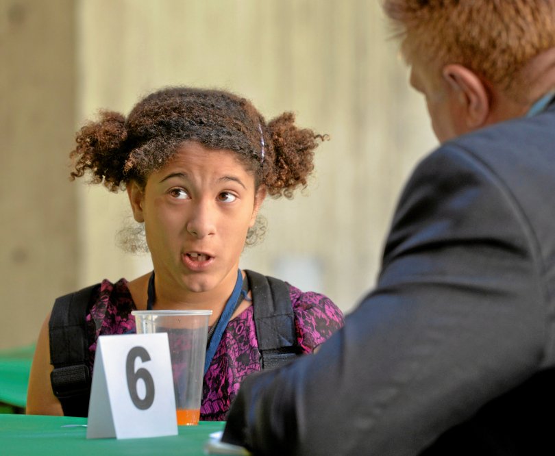 Washington Middle School student Patricia Foley experiences a mock job interview, part of the Education Equals Opportunity Too foundation’s efforts to help low-income youths prepare for careers. The organization also took the students on a tour of City Hall.